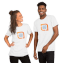 Man and woman laughing modeling Bella Canvas shirts with logo design sample on the front